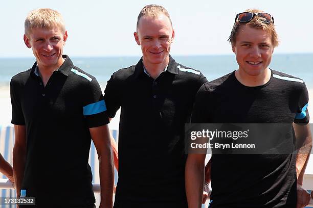 Procycling riders Kanstanstin Siutsou, Chris Froome, Edvald Boasson-Hagen walk to their team press conference at the Hermitage Hotel during the first...