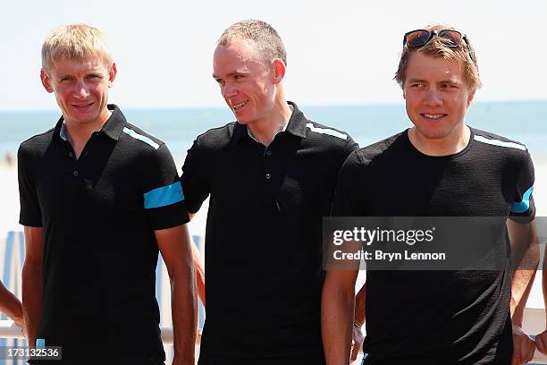Procycling riders Kanstanstin Siutsou, Chris Froome and Edvald Boasson-Hagen walk to their team press conference at the Hermitage Hotel during the...
