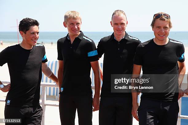Procycling riders Peter Kennaugh, Kanstanstin Siutsou, race leader Chris Froome and Edvald Boasson-Hagen walk to their team press conference at the...
