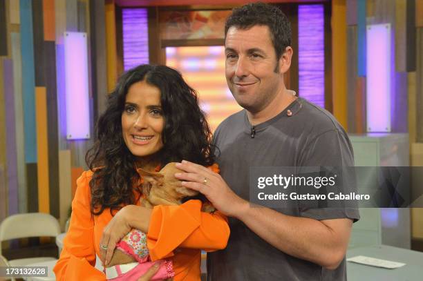 Salma Hayek and Adam Sandler of "Grown Ups 2" cast appears on Univisions "Despierta America" to promote the movie at Univision Headquarters on July...