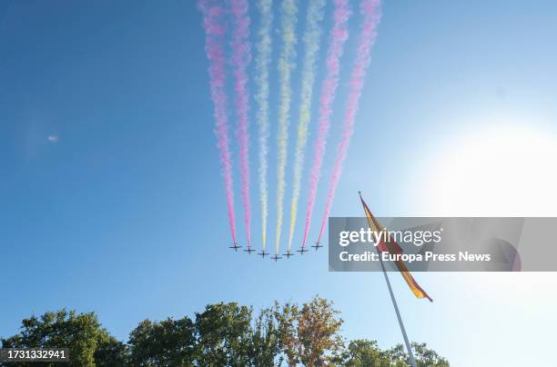 The colors of the flag of Spain by the Eagle Patrol during the parade of October 12 'National Holiday Day', in the Plaza de Canovas del Castillo, on...