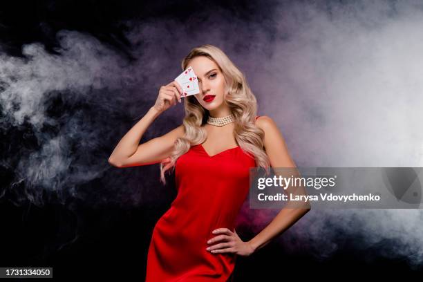 photo of chic lady poker cheater close face with playing poker cards lucky winning jackpot over mist dark background - cheater stock pictures, royalty-free photos & images