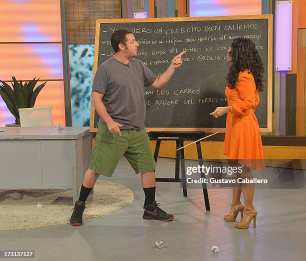 Adam Sandler and Salma Hayek of "Grown Ups 2" cast appears on Univisions "Despierta America" to promote the movie at Univision Headquarters on July...