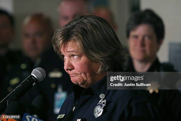 San Francisco fire department Lt. Crissy Emmons, a first responder to the crash of Asiana Airlines flight 214, reacts as she speaks to reporters...