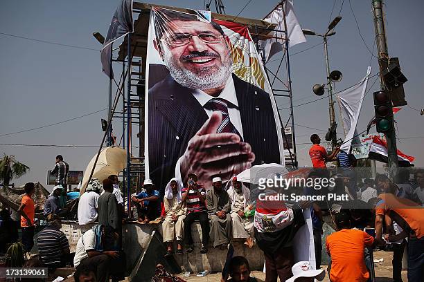 Pro Mohamed Morsi supporters attend a rally near where over 50 were purported to have been killed by members of the Egyptian military and police in...