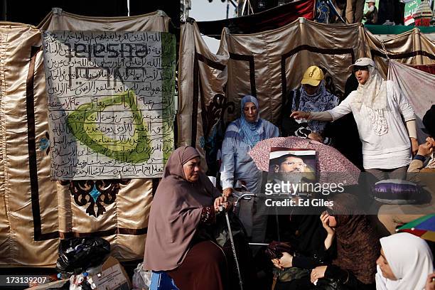 Supporters of deposed Egyptian President Mohammed Morsi demonstrate at the Rabaa al-Adweya Mosque in the Nasr City district on July 8, 2013 in Cairo,...
