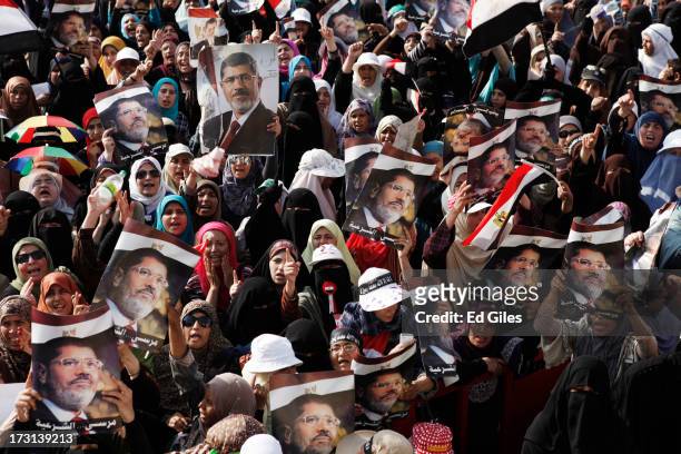 Supporters of deposed Egyptian President Mohammed Morsi demonstrate at the Rabaa al-Adweya Mosque in the Nasr City district on July 8, 2013 in Cairo,...