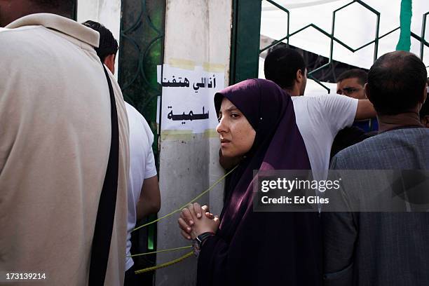 Supporter of deposed Egyptian President Mohammed Morsi takes part in a demonstration at the Rabaa al-Adweya Mosque in the Nasr City district on July...
