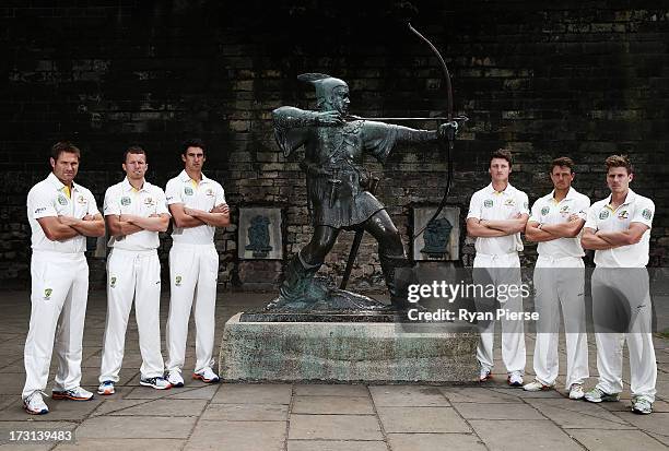 Ryan Harris, Peter Siddle, Mitchell Starc, Jackson Bird, James Pattinson and James Faulkner of Australia pose with the Robin Hood statue during an...