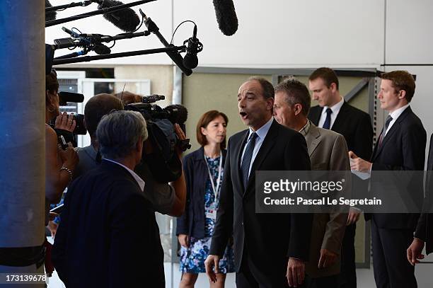 Jean-Francois Cope addresses the press as he arrives at the UMP headquarters to attend an extraordinary meeting of UMP right-wing opposition party...