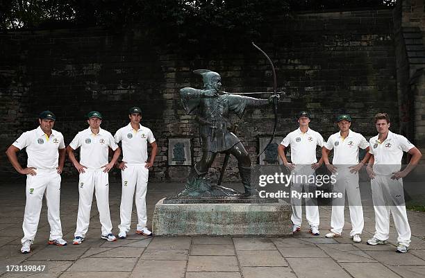 Ryan Harris, Peter Siddle, Mitchell Starc, Jackson Bird, James Pattinson and James Faulkner of Australia pose with the Robin Hood statue during an...