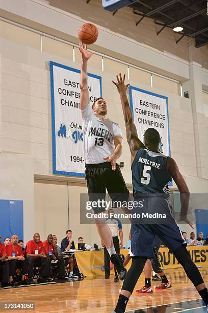 Miles Plumlee of the Indiana Pacers shoots over Arnett Moultrie of the Philadelphia 76ers during the 2013 Southwest Airlines Orlando Pro Summer...