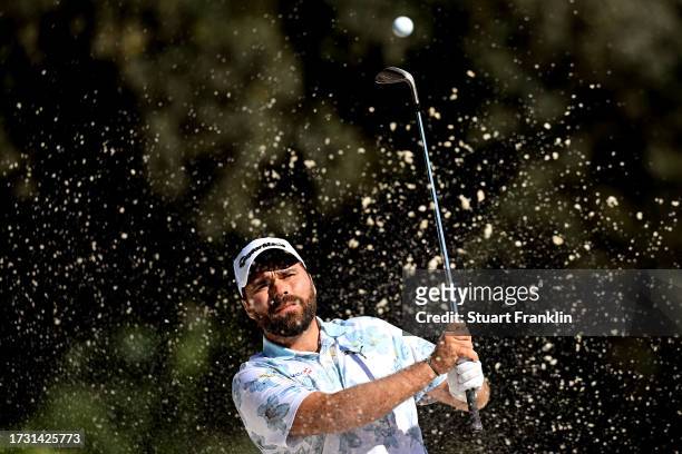 Romain Langasque of France plays out of a bunker on the fourth hole on Day One of the acciona Open de Espana presented by Madrid at Club de Campo...