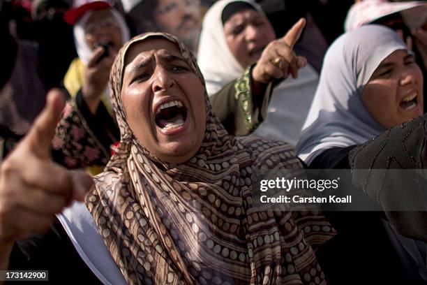 Pro-Mohamed Morsi supporters rally near to where over 50 people were purported to have been killed by members of the Egyptian military and police in...