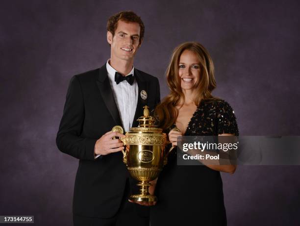 Andy Murray of Great Britain poses his poses with his girlfriend Kim Sears and the Gentlemen's Singles Trophy at the Wimbledon Championships 2013...