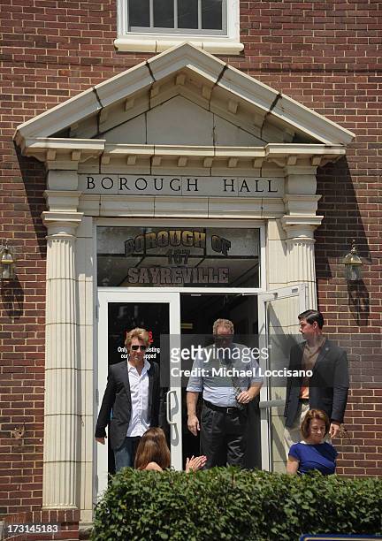 Musician Jon Bon Jovi walks out of Borough Halll to attend the Hurricane Sandy New Jersey Relief Fund Press Conference at Sayreville Borough Hall on...