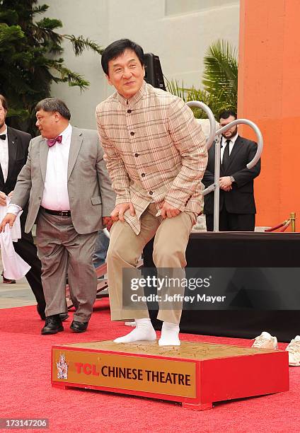 Actor Jackie Chan poses at his hand/footprint cement ceremony at TCL Chinese Theatre on June 6, 2013 in Hollywood, California.