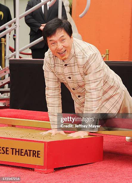 Actor Jackie Chan poses at his hand/footprint cement ceremony at TCL Chinese Theatre on June 6, 2013 in Hollywood, California.