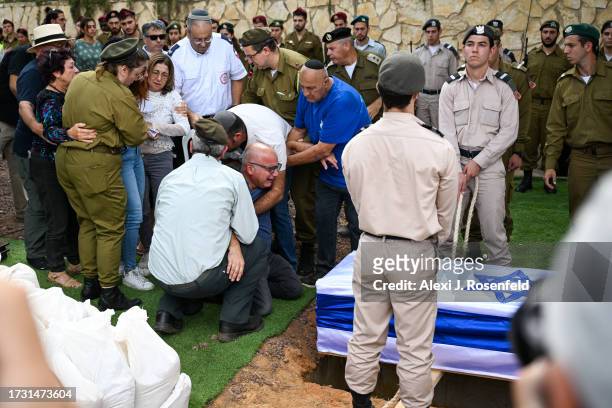 The father of Valentin Ghnassia who was killed in a battle with Hamas militants at Kibbutz Be’eeri near the Israeli border with the Gaza Strip cries...