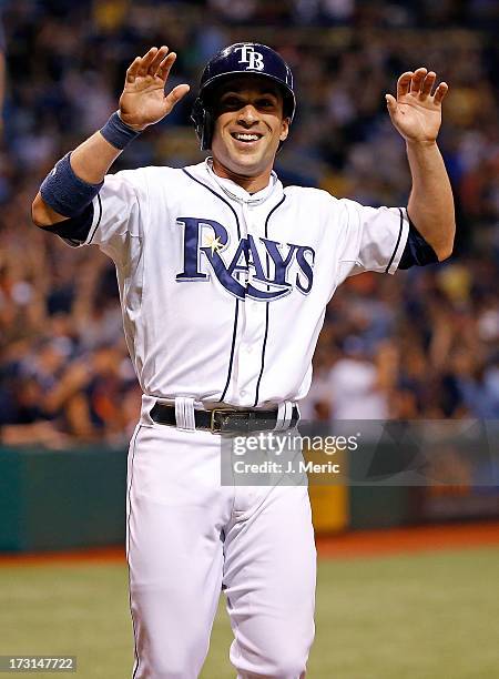 Sam Fuld of the Tampa Bay Rays celebrates after scoring the winning run against the Detroit Tigers during the game at Tropicana Field on June 29,...