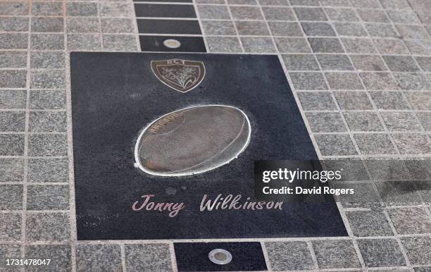 Slab honouring the former Toulon and England player, Jonny Wilkinson, lies in the pavement outside the stadium during the Wales training session at...