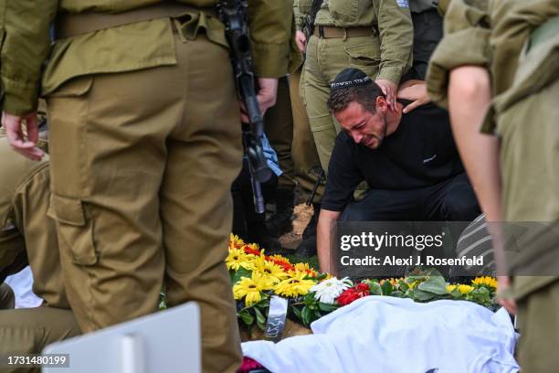 Family and friends of Valentin Ghnassia who was killed in a battle with Palestinian militants at Kibbutz Be’eeri near the Israeli border with the...