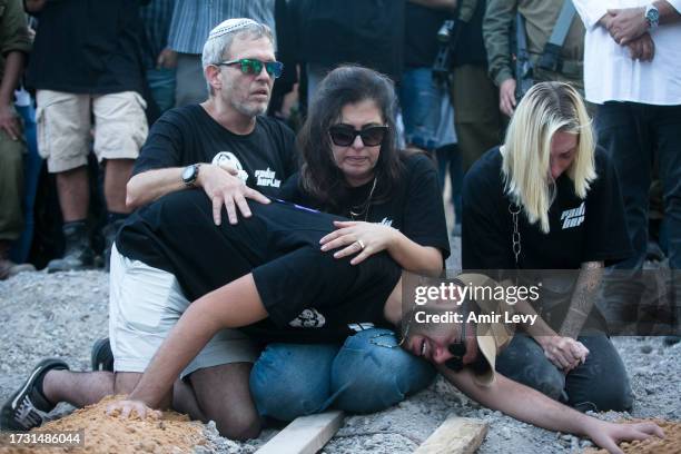 Family and friends of siblings Noa and Gideon Chiel, who were killed in the Nova party by Palestinians militants mourn during their funeral on...