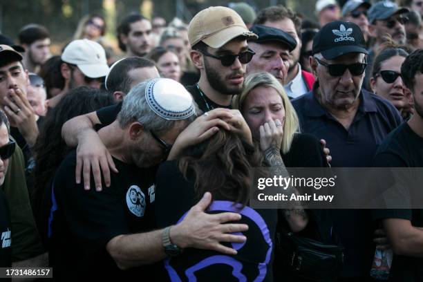 Family and friends of siblings Noa and Gideon Chiel, who were killed in the Nova party by Palestinians militants mourn during their funeral on...
