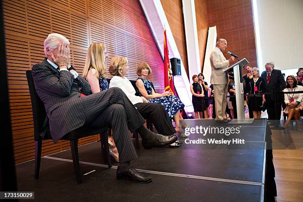 Former President Bill Clinton, Chelsea Clinton, Hillary Rodham Clinton, Anna Wintour and Oscar De La Renta attend the Oscar De La Renta: American...