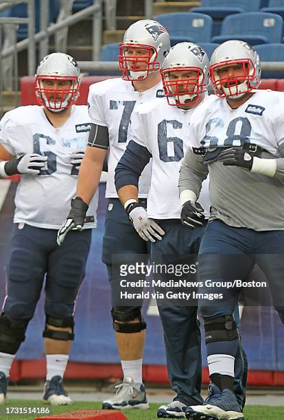 Offensive lineman Josh Kline, tackle Nate Solder, offensive lineman Dan Connolly, and practice squad offensive lineman Caylin Hauptmann take turns...