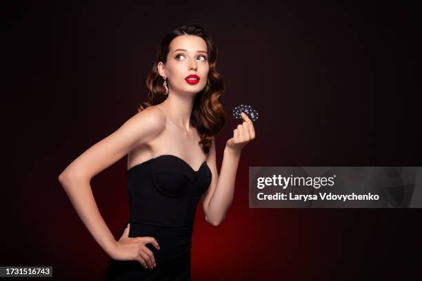 photo of classy attractive lady with poker chips look on new professional club advert over dark background - casino dealer stock pictures, royalty-free photos & images