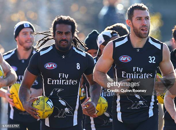 Harry O'Brien of the Magpies trains back with his team mates during a Collingwood Magpies AFL training session at Olympic Park on July 9, 2013 in...