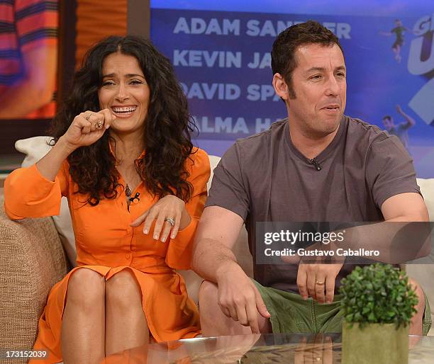 Salma Hayek and Adam Sandler of "Grown Ups 2" cast appears on Univisions "Despierta America" to promote the movie at Univision Headquarters on July...