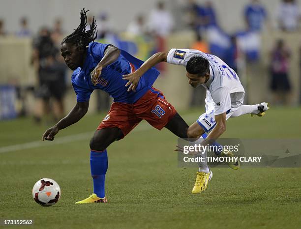 Honduras' Edder Delgado challenges Haiti's Leonel Saint Preux during their CONCACAF Gold Cup match on July 8, 2013 at the Red Bull Arena in Harrison,...