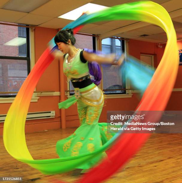 Kathleen Li of Lexington, Mass., rehearses her Chinese dance routine at Chu Ling Dance Academy in Chinatown in Boston, Sunday, Dec. 26 for their...
