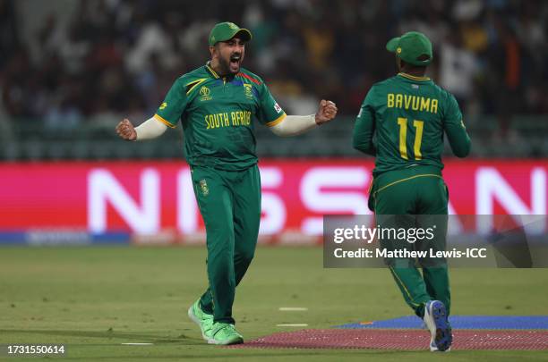 Tabraiz Shamsi and Temba Bavuma of South Africa celebrate the wicket of Mitchell Marsh of Australia during the ICC Men's Cricket World Cup India 2023...