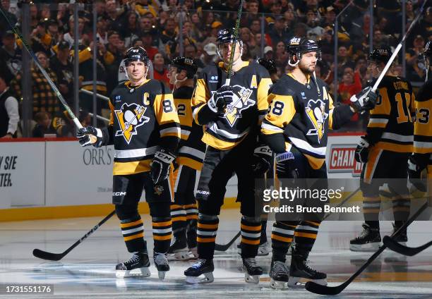 Sidney Crosby, Evgeni Malkin and Kris Letang of the Pittsburgh Penguins prepare to play against the Chicago Blackhawks at PPG PAINTS Arena on October...