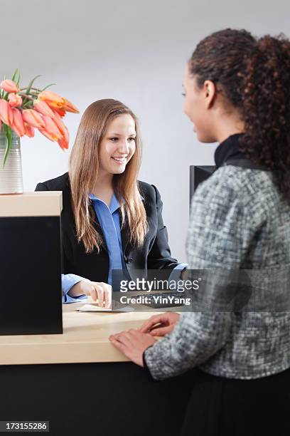 Friendly Smiling Bank Teller Helping Customer At Counter Window Vt High-Res  Stock Photo - Getty Images