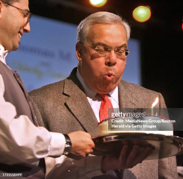 Boston's "First Night for Seniors" at the World Trade Ctr..Here, Boston Mayor Thomas Menino , himself a birthday boy, blows out candles on a birthday...