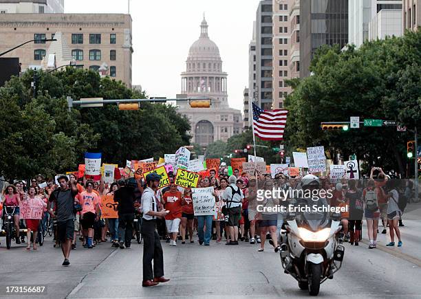 Pro-choice protesters march down Congress Avenue and back to the Texas state capitol as pro-life supporters and pro-choice protesters rally at the...