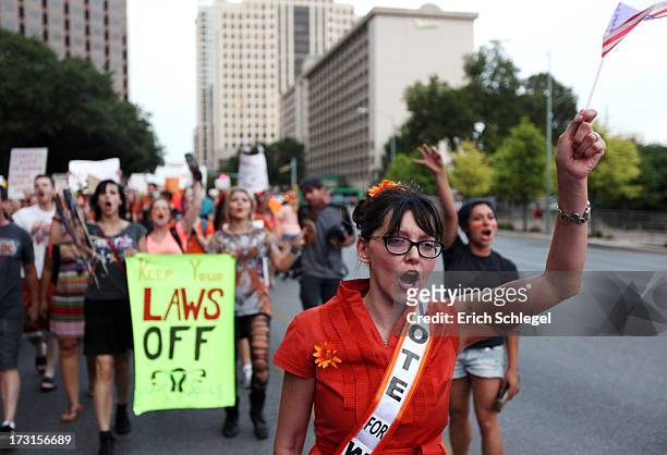 Pro-choice protesters march down Congress Avenue and back to the Texas state capitol as pro-life supporters and pro-choice protesters rally at the...
