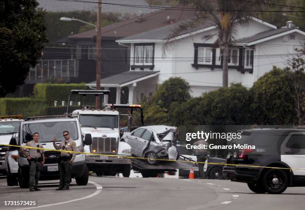 Sheriff deputies monitor the scene where four women were killed in a multi-vehicle crash in Malibu on October 18, 2023. A 22-year-old man was...