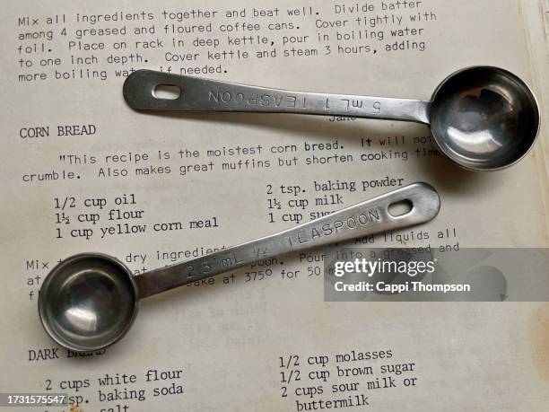 corn bread recipe with measuring spoons - cookbook stock pictures, royalty-free photos & images