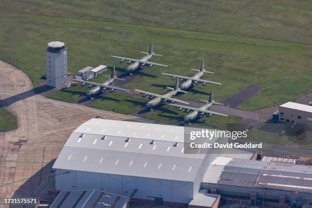 In an Aerial view, five C-130 Hercules aircraft at Cambridge City Airport waiting for maintenance on October 10 in Cambridge, United Kingdom.