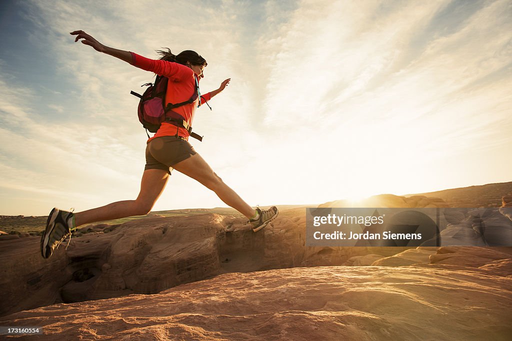 A female dayhiking in Arches Park.