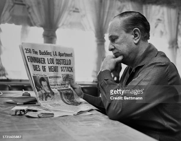 Bud Abbott reads a newspaper article announcing the death of his comedy partner Lou Costello of a heart attack, Hollywood, California, March 4th...