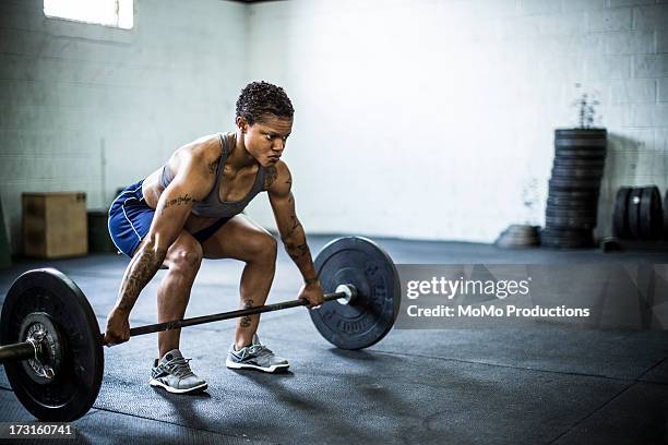 woman doing gym/deadlift - deadlift stock pictures, royalty-free photos & images