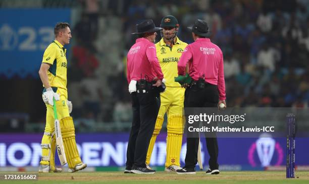 Marcus Stoinis and Marnus Labuschagne of Australia interacts with Match Umpire Richard Illingworth and Joel Wilson after being dismissed from a...