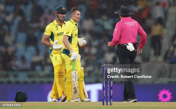 Marcus Stoinis and Marnus Labuschagne of Australia interacts with Match Umpire Richard Illingworth after being dismissed from a review during the ICC...