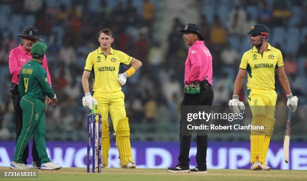 Marcus Stoinis and Marnus Labuschagne of Australia interacts with Temba Bavuma of South Africa and Match Umpires Richard Illingworth and Joel Wilson...